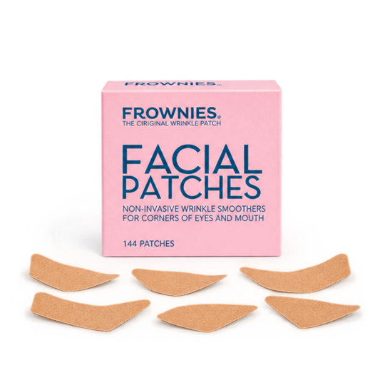 Frownies Facial Patches – Rosa förpackning för ögonvrår och kring munnen med plåster utspridda framför.