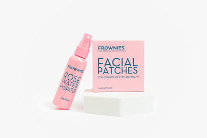 Frownies Rose Water Hydrator och Facial Patches-förpackning uppställda mot vit bakgrund.