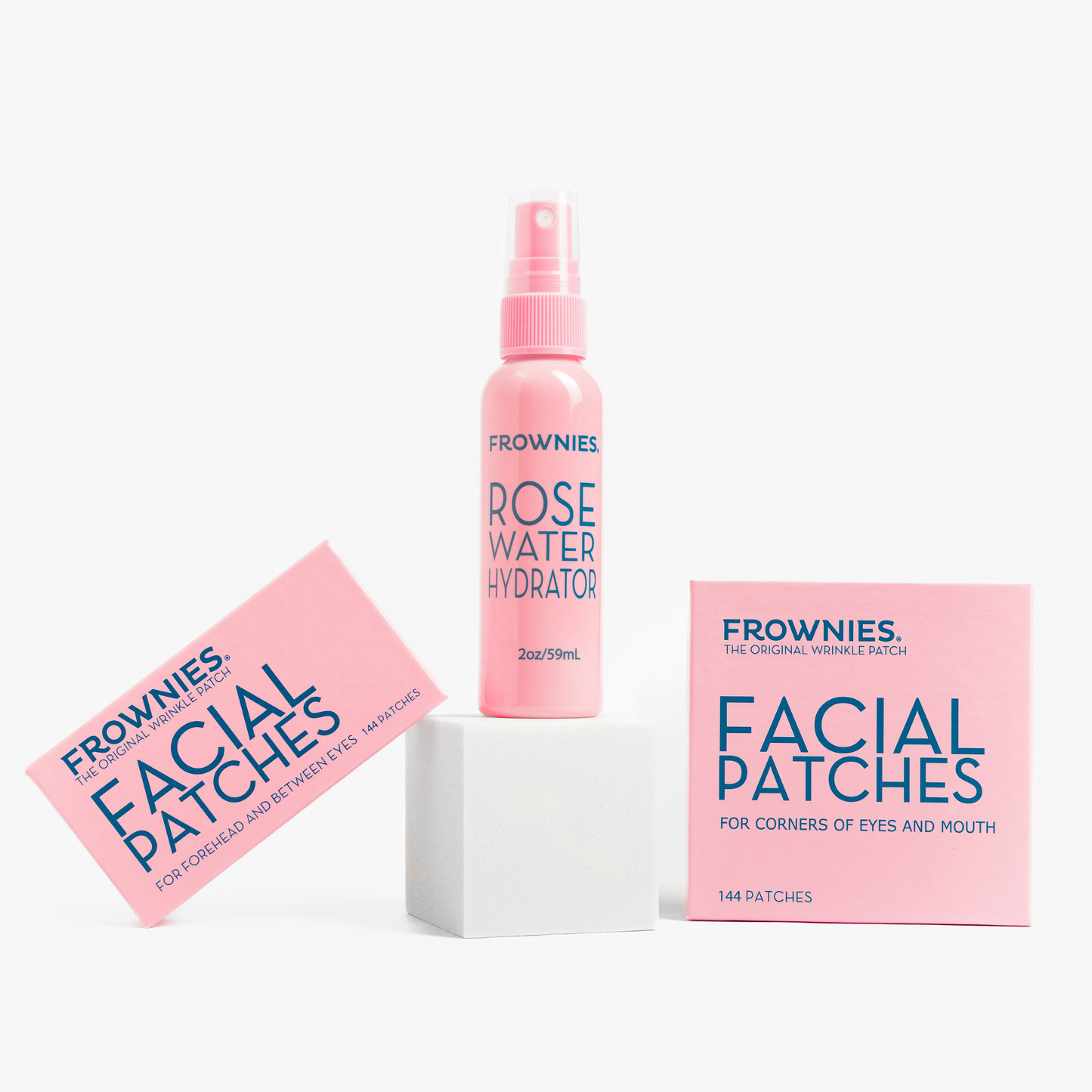 Frownies Startkit – Rose Water Hydrator och Facial Patches-förpackning uppställda mot vit bakgrund.