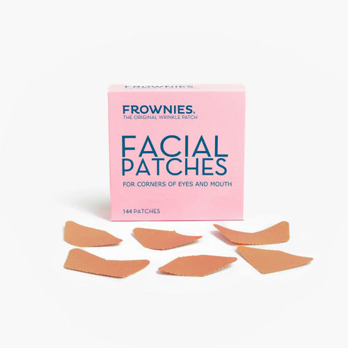 Frownies Facial Patches – Rosa förpackning för ögonvrår och kring munnen med plåster utspridda framför.