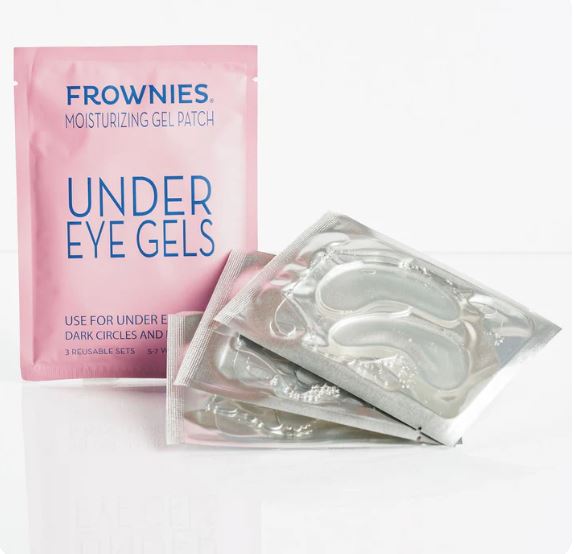 Frownies Under Eye Gels – Rosa förpackning med silvriga gelmasker för ögonen mot vit bakgrund.